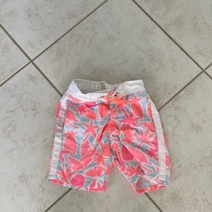 Orange and white Mini Boden swim trunks